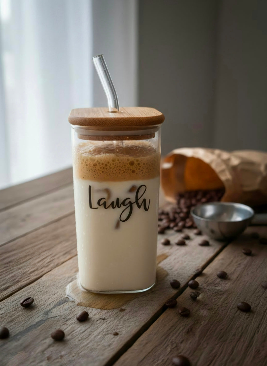 Dalgona coffee in a laugh glass with scattered coffee beans.